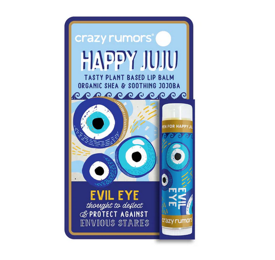 Happy Juju Evil Eye Lip Balm tube packaged on an illustrated hang card with blue and gold eveil eyes.