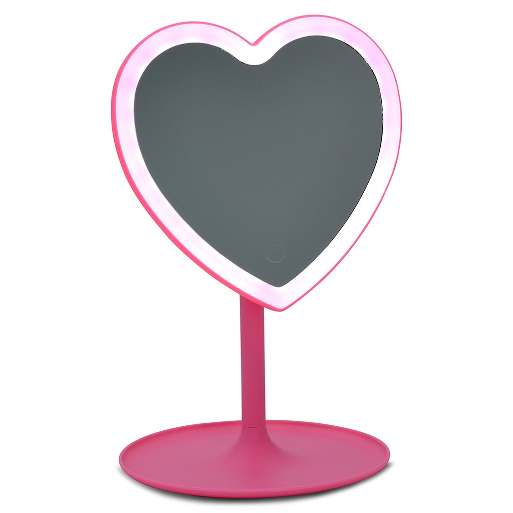 Heart shaped vanity mirror with pink stand and catch all tray. 