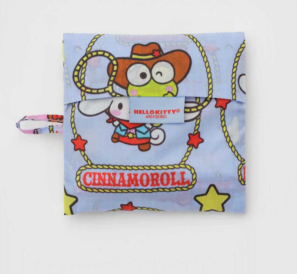 Foldable Baggu shopping bag with Hello Kitty and Friends characters wearing western gear in the flat 5x5 pouch it is stored in. 