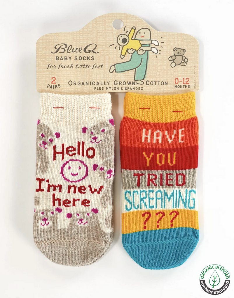Set of baby socks "Hello I'm New Here" and "Have You Tried Screaming?" attached to to a hang card. 