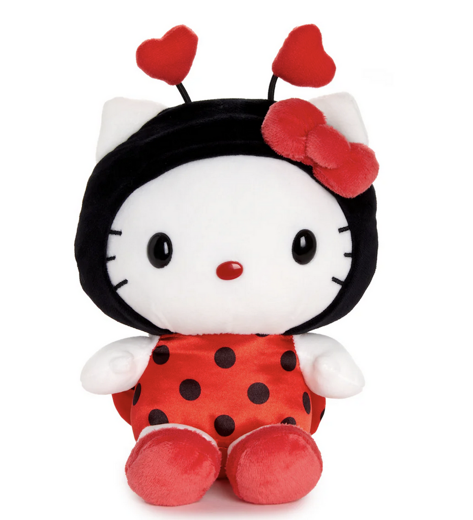 Plush Hello Kitty dressed in a ladybug costume with heart shaped antennae and a red and black polka dot outfit. 