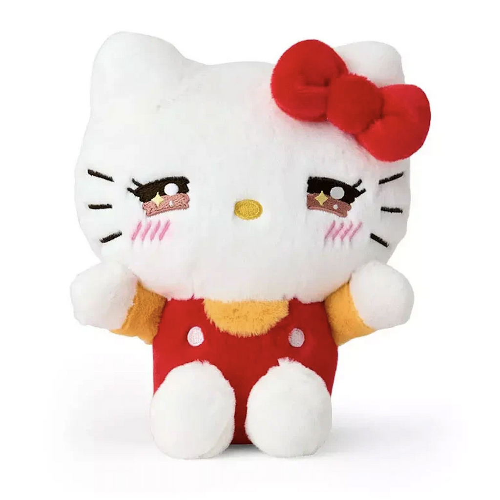 Hello Kitty Sparkling Emotions stuffed animal wearing red overalls with a yellow shirt and red bow in a seated pose. 