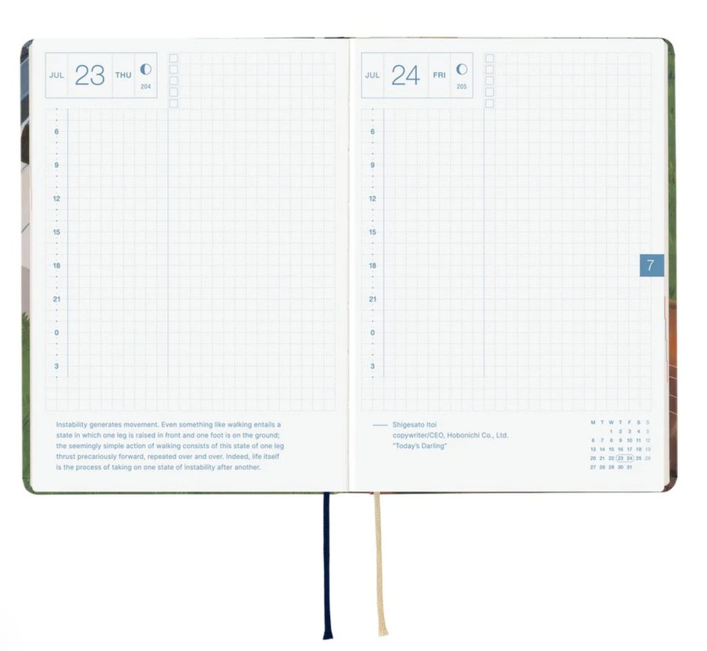 The Hobonichi Techo Hiroko Kubota 2026 Planner opened to show pages for July 23 & 24. The 23rd is on the left side, the 24th is on the right side with the date posted in the top left corner of the page and a mainly blank grid pages that have inspirational quotes at the bottom. 
