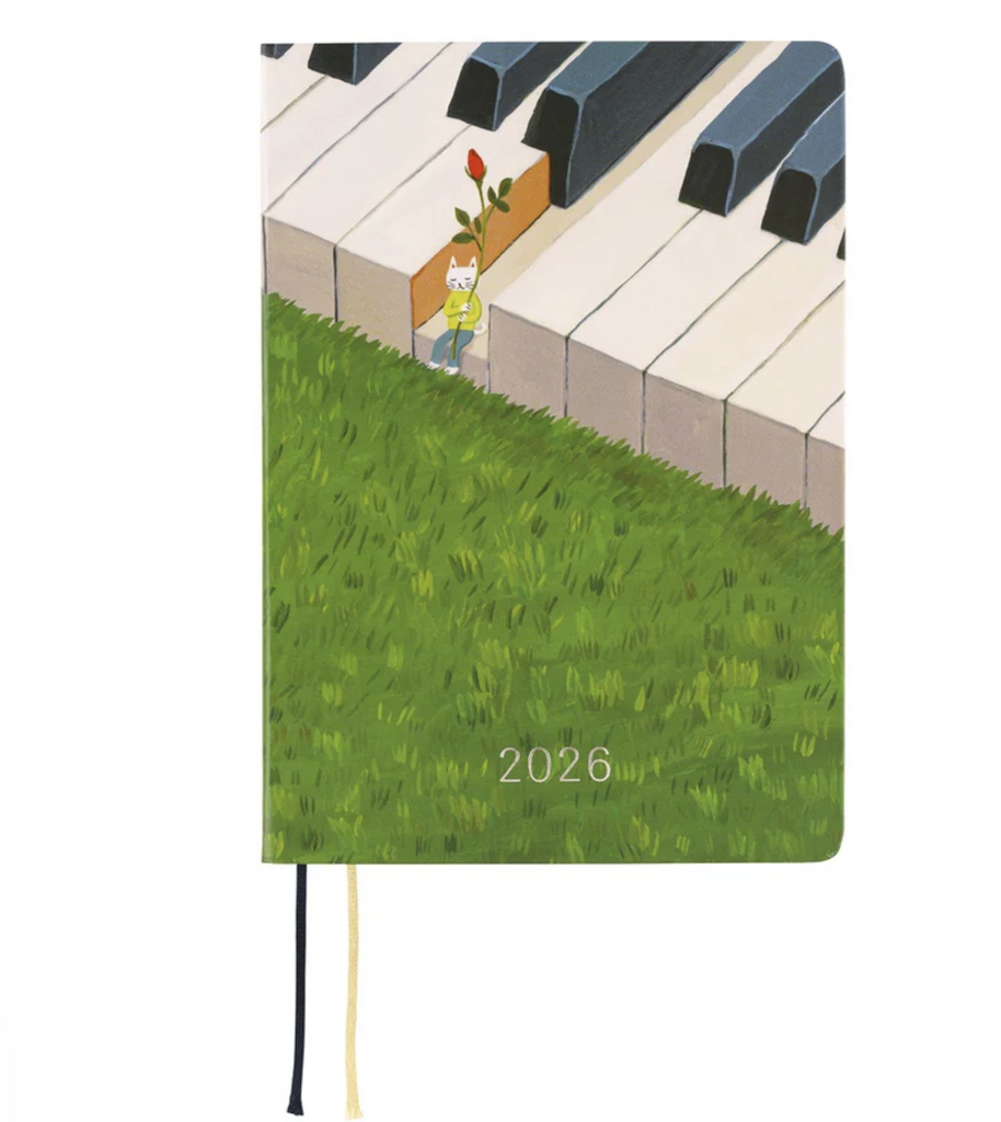 Hobonichi_Techo_Hiroko_Kubota_2026_Planner front cover with an illustration of a piano with a small cat sitting on one of the ivory keys, as if waiting for something.