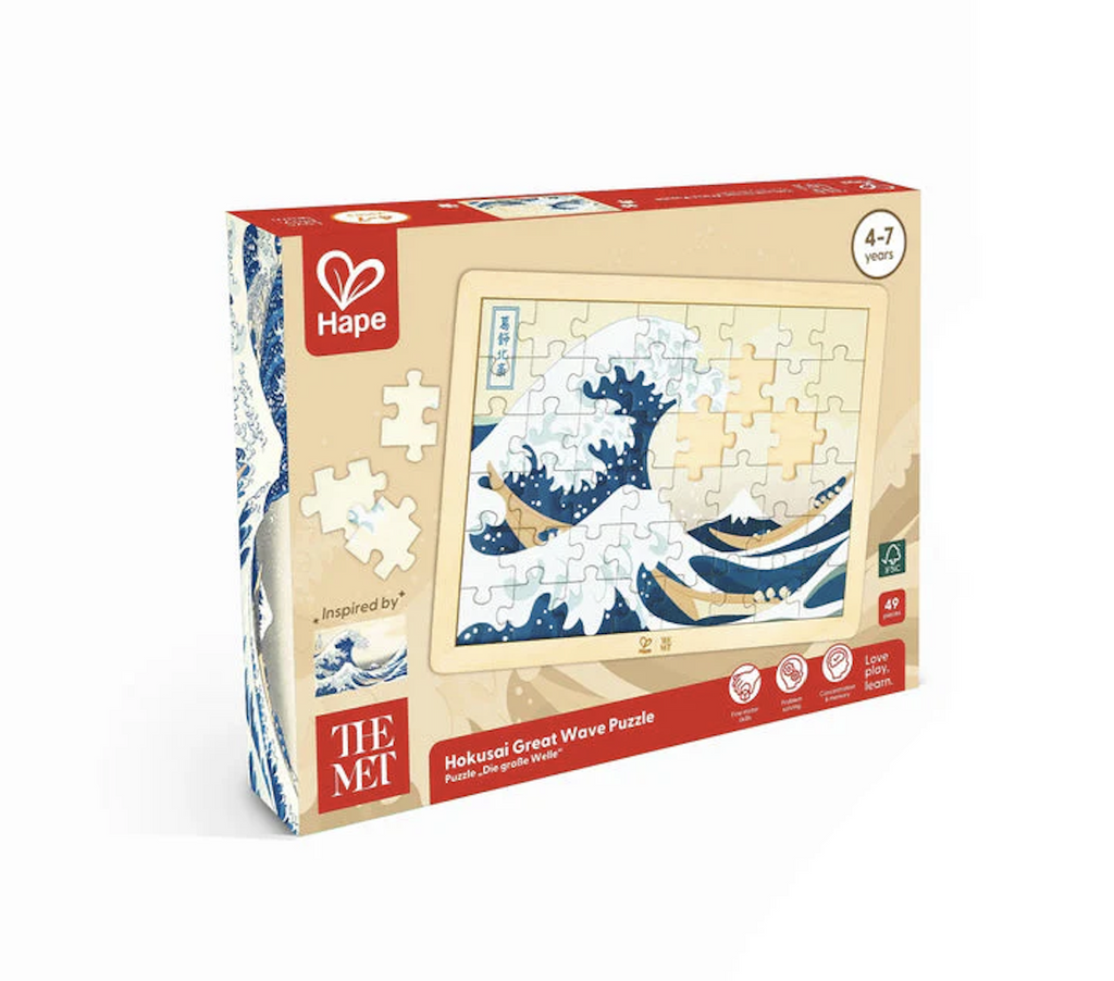 Hokusai Great Wave Wooden puzzle in a box with a picture of the puzzle not quite finished. 