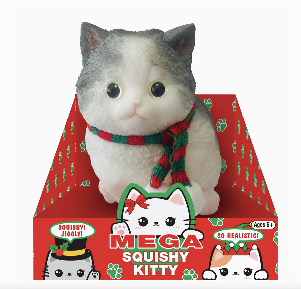 Mega Squishy Kitty with white and gray fur wearing a red and green striped scarf sitting in a holiday themed box. 