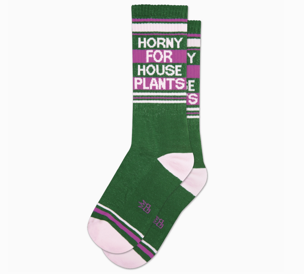 Dark green tube socks with white and fuschia stripes that read "Horny For House Plants" in white letters. 