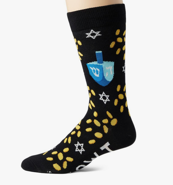 Black sock with dreidels, gold coins, and stars on a white background.