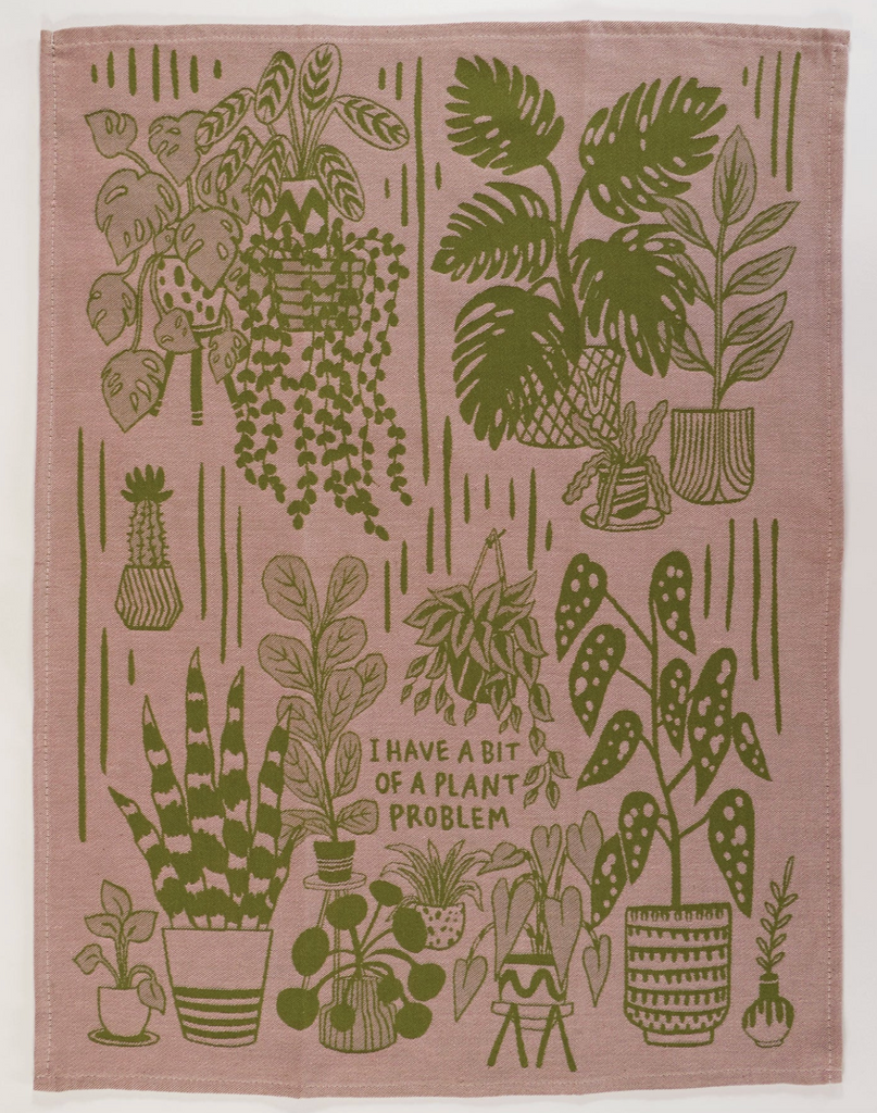 Khaki colored dish towel laid flat with illustrations of lots of plants. 