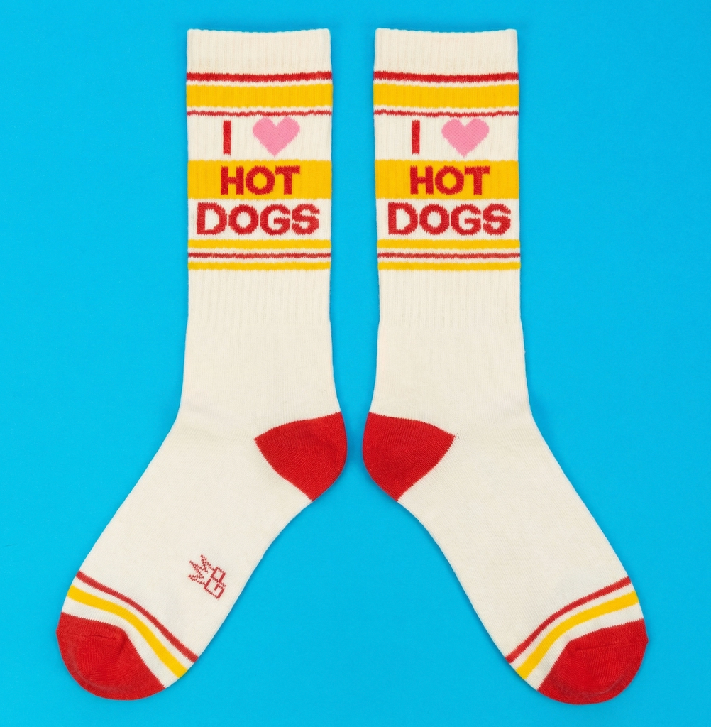 Crew socks that read "I Heart Hot Dogs" on a blue background. 