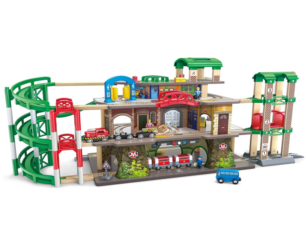 Railway toy set featuring a four-story city structure, including a Maintenance Depot on top, a Train Washing & Refuelling Station, a bustling City Scene, and a Subway on the ground floor. 