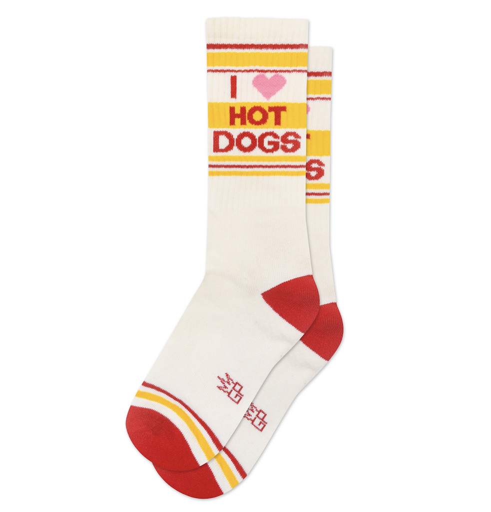 White crew socks with I heart Hot Dogs written on them with yellow and ed striping. 