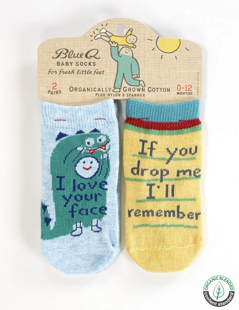 Set of baby socks attached to a hang card for with one pair that reads "If you drop me I'll remember" and the other "I Love Your Face" 