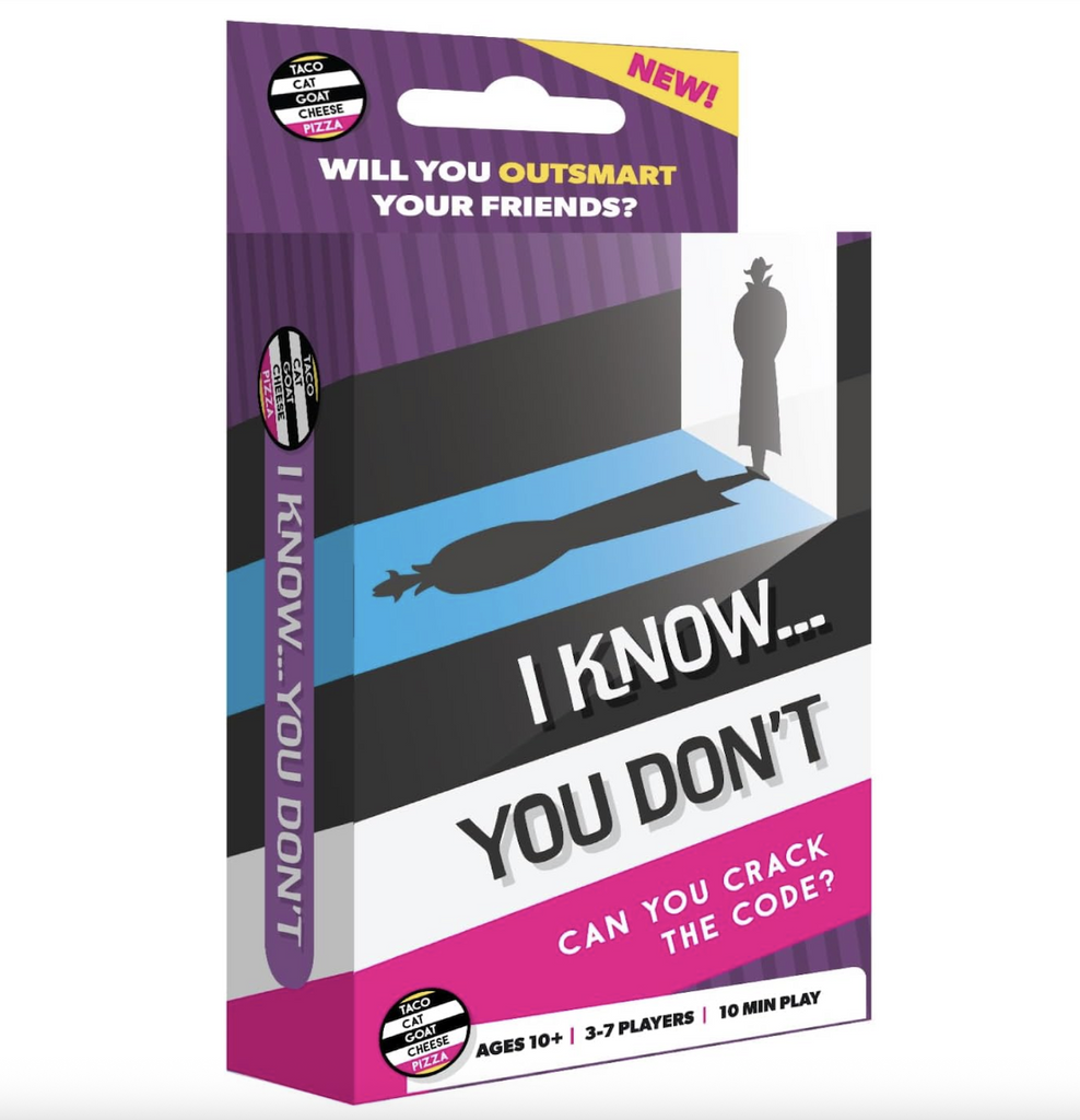 Box containing the "I Know, You Don't" deck with purple, black, white and hot pink stripes, there is also an image of a detective in silhouette casting a long shadow across the front of the box. The title is written in white and black lettering. 