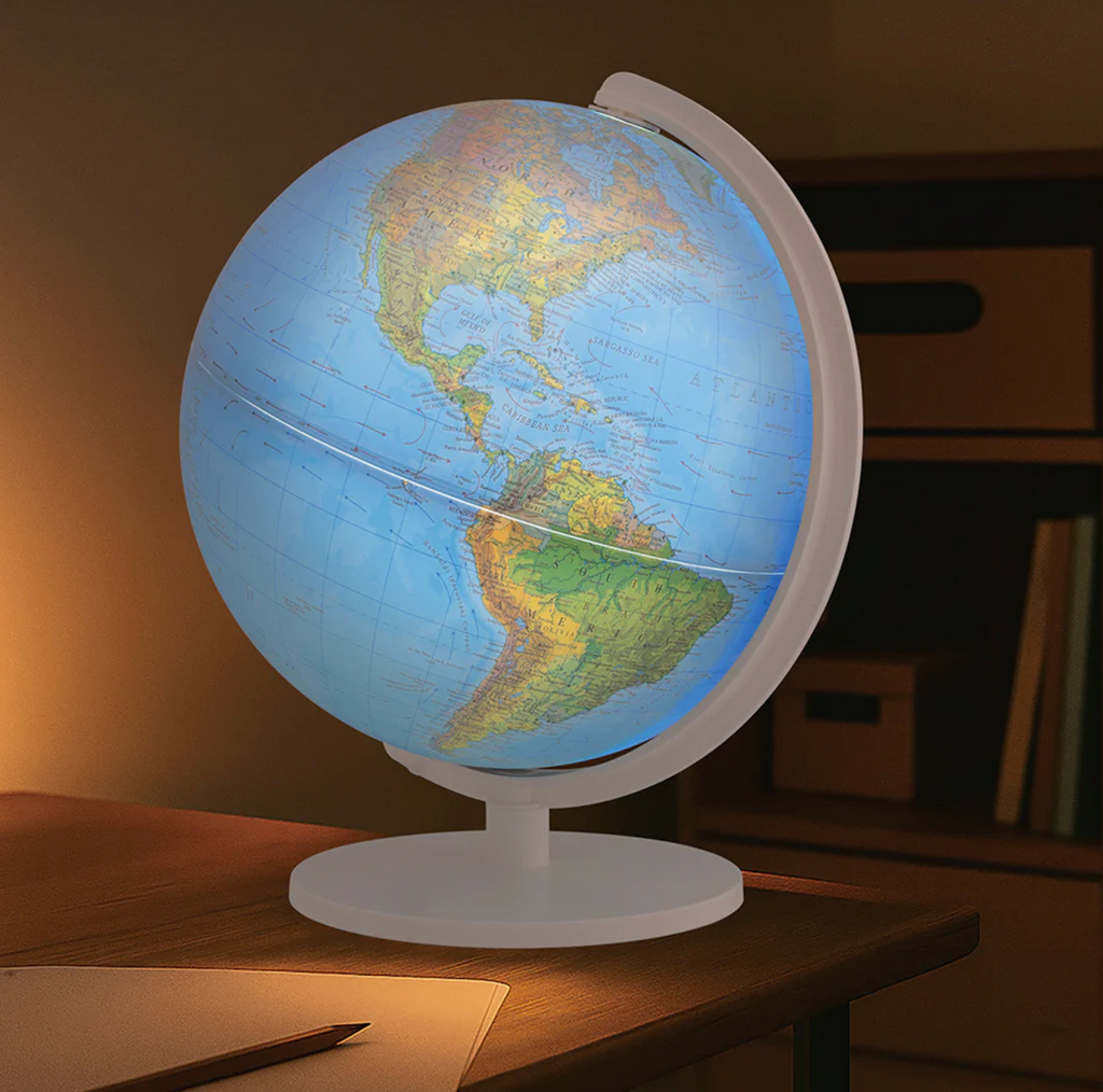 Geopolitical Globe illuminated while sitting on a desk. 