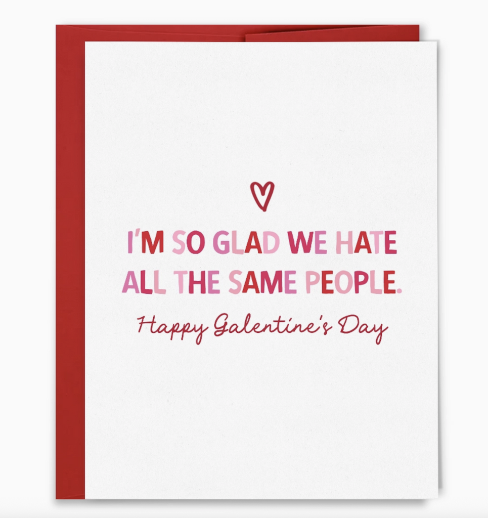 Greeting card with pink and red lettering that reads "I'm so glad we hate all the same people. Happy Galentine's Day" 