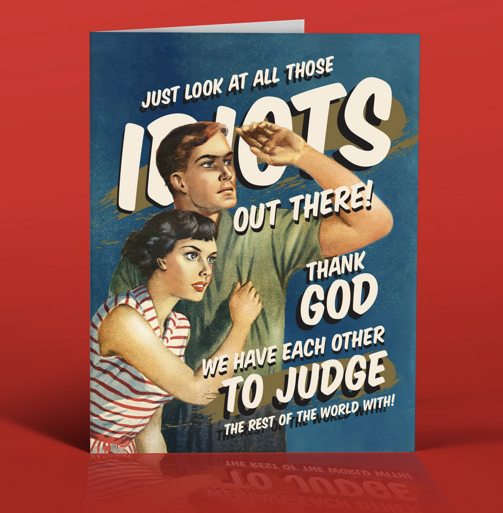 Greeting card with a retro couple looking into the distance that reads "Just Look At All Those Idiots out there! Thank Gid We Have Each Other To Judge The Rest Of The World With!"