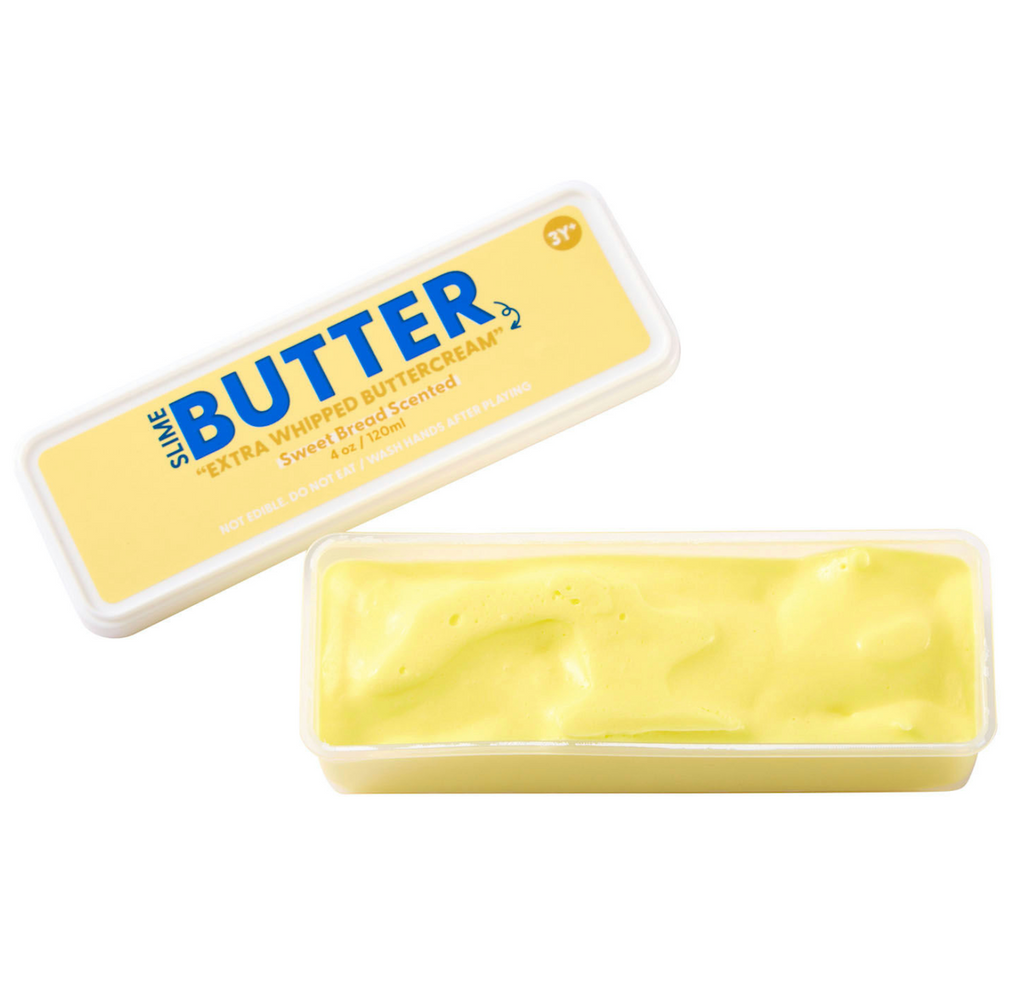 The J'adore Butter Slime with the top off of the rectangle container it's packaged in. 