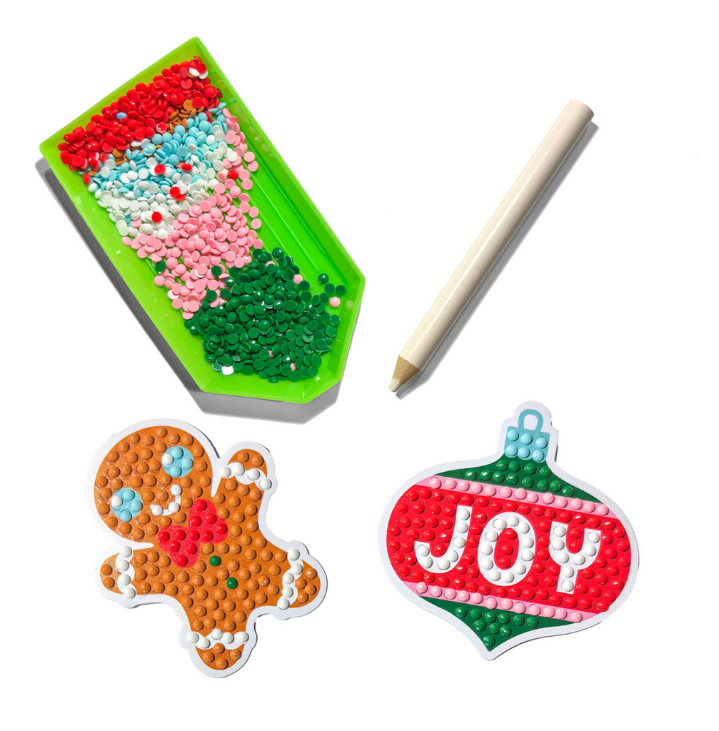 A tray full of mini gem stickers used in the making of gingerbread and ornament stickers. 