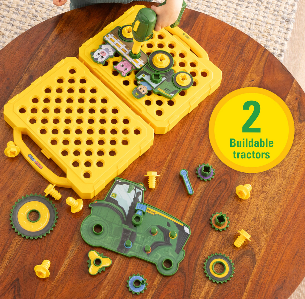 The John Deere Build A Buddy Activity Board opened to show two sides that can be used to build the tractors and farm animals that included in the set. 