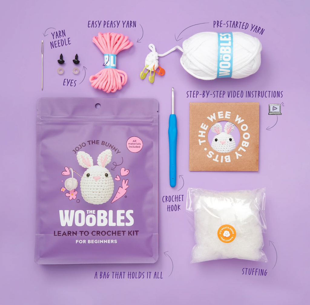 Woobles crochet kit with white and pink yarns, stuffing, crochet hook and needle as well step by step video instructions. All can be kept inside the reuseable bag it comes packaged in. 