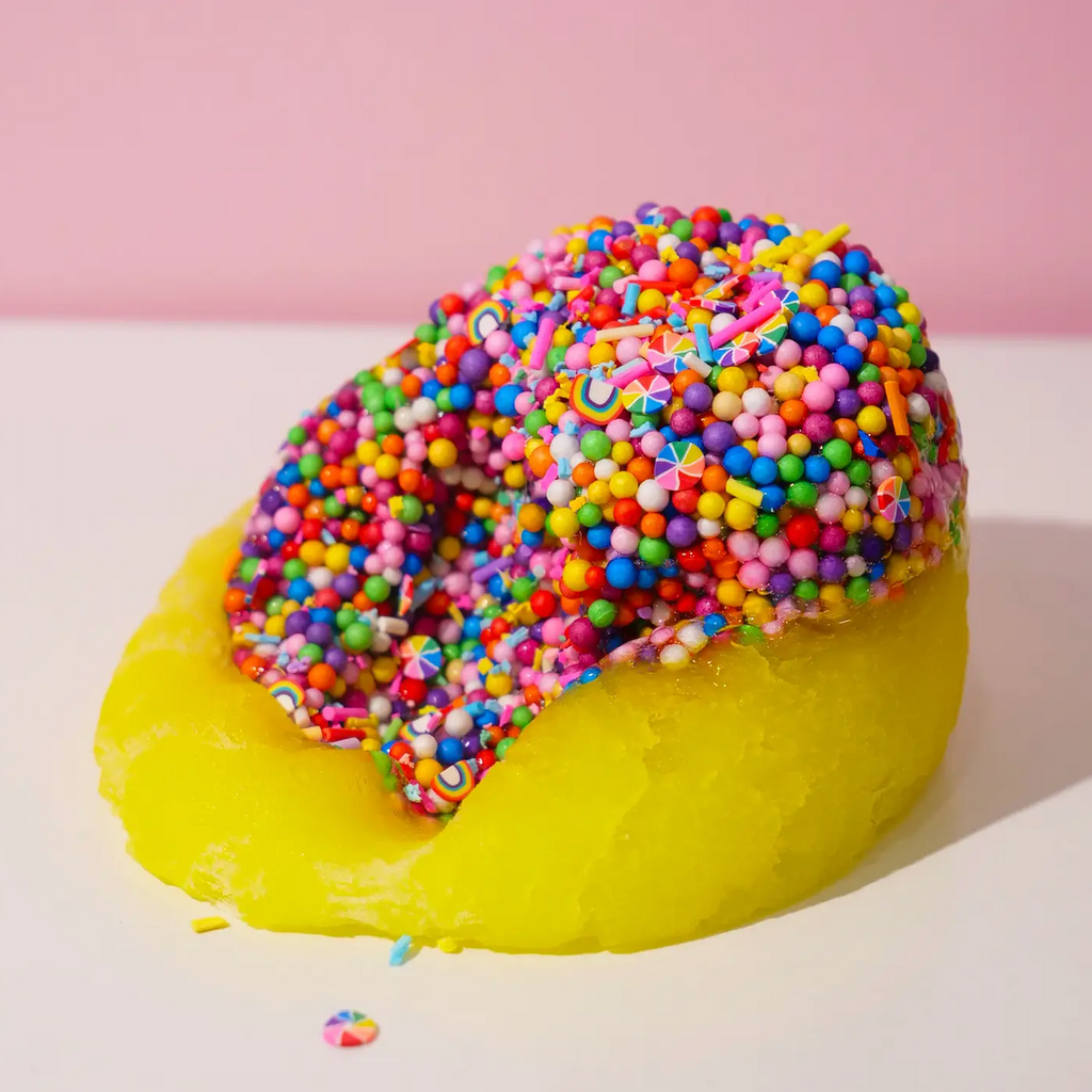 Yellow Joy slime with rainbow sprinkles and confetti to mix in. (Not food)