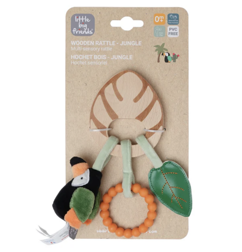 The Jungle Wooden Rattle with a plush toucan, teething ring, and crinkle leaf hanging off of a wooden leaf. 