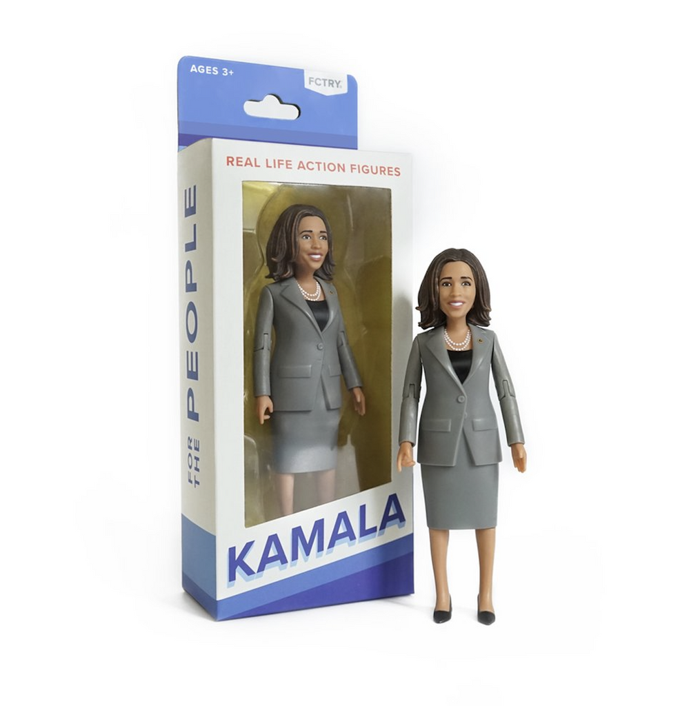 The Kamala Harris action figure in it's box with a clear window and white and blue coloring. 