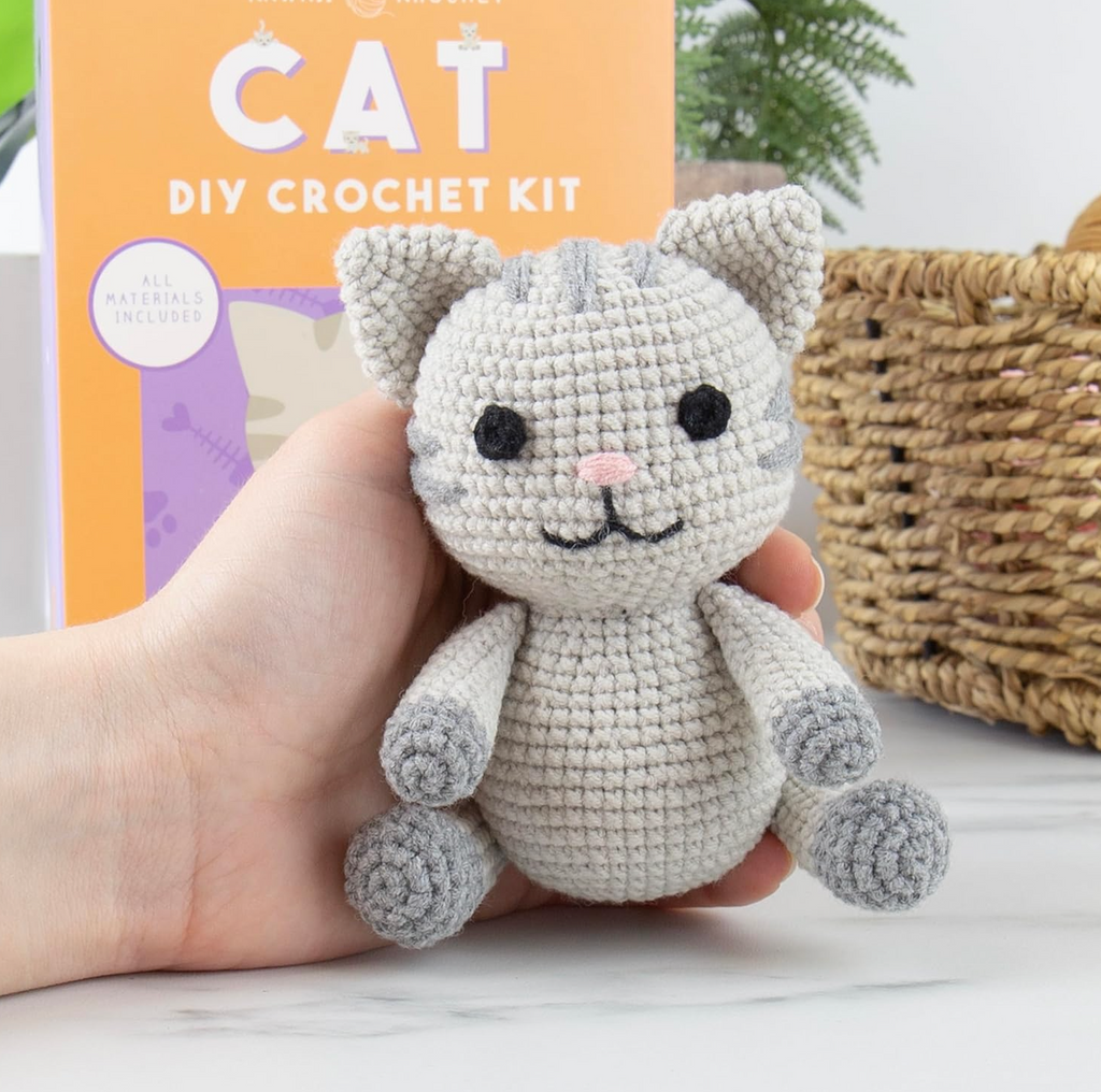 Close up of a completed crocheted grey kitty made using the Kawaii Cat Crochet Kit. 