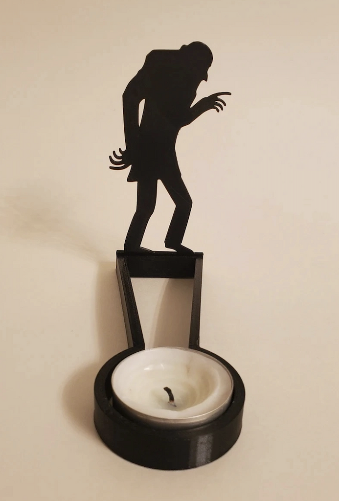Kealite Nosferatu Shadow Caster and tea light stand set up. The Silhouette of Nosferatu will cast an awesome shadow. 