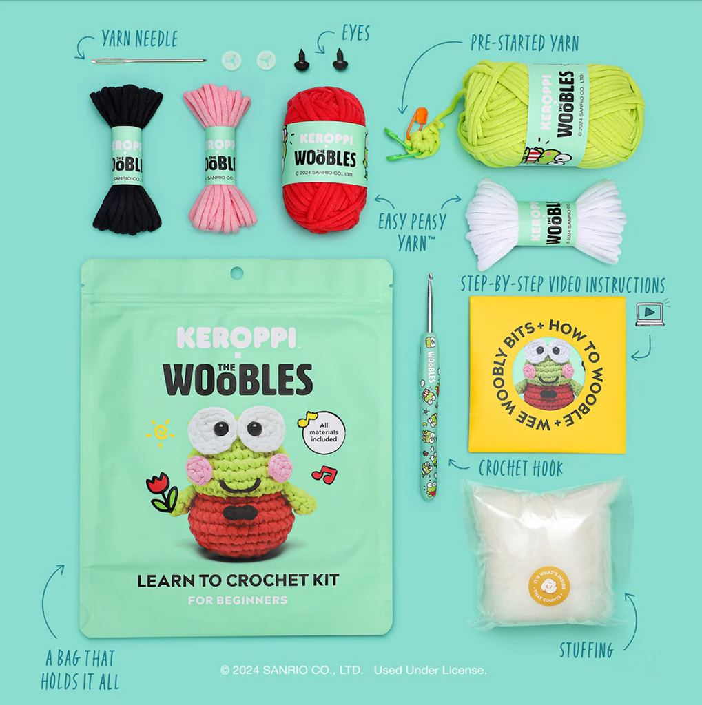 Keroppi Crochet Kit with all the supllies included laid out around the bag it all comes packaged in. With five different colors of yarn, a yarn needle, plastic eyes, stuffing and a crochet hook. 