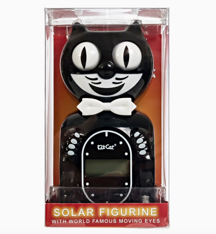 Solar powered Kit Cat clock in black with white bowtie and moving eyes packaged in a clear plastic box. 