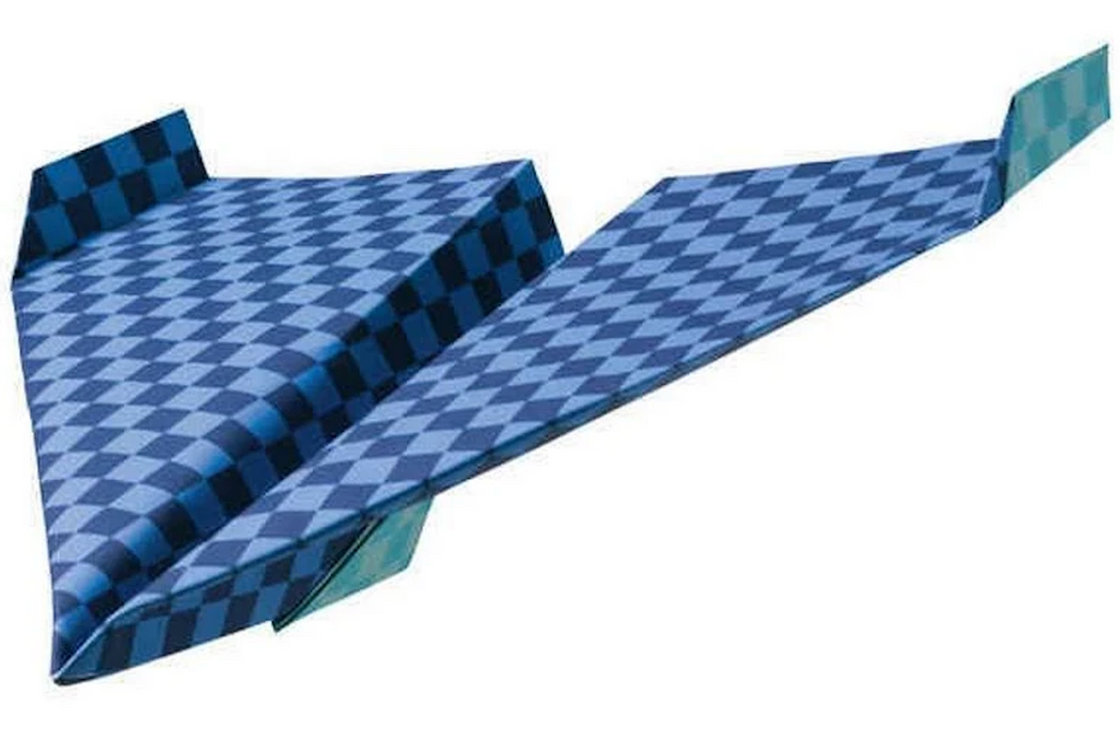 A blue and navy checkered paper airplane folded from Klutz Paper Airplane craft kit. 