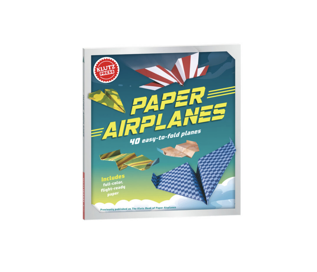 Klutz Paper Airplanes craft kit, packaged in a book like box with pictures of several of the paper airplanes flying through the air on the front cover. 