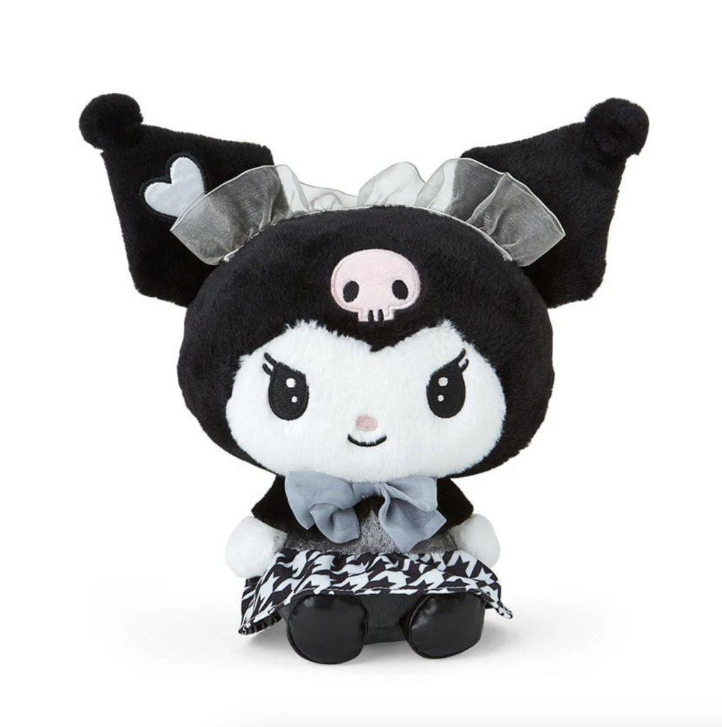 Plush Kuromi in a seated pose wearing a black and white dress with a houndstooth pattern a frilly white headband and a white heart on her ear. 