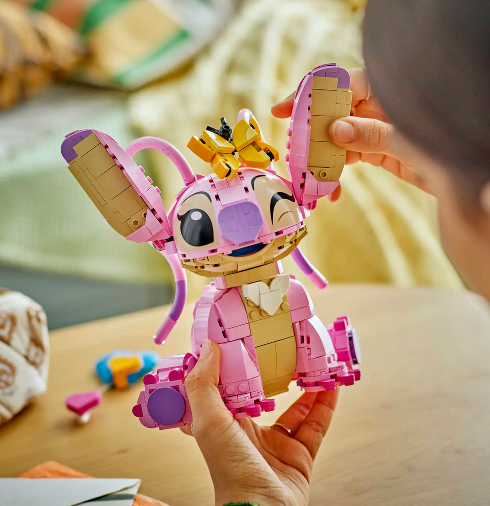 The LEGO DIsney Angel figure in the process of having her ears attached as well as few last LEGO pieces. 