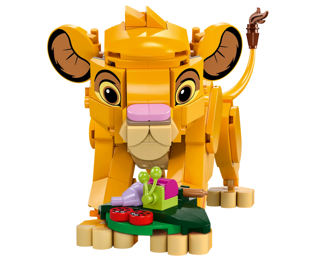 Simba the Lion Cub LEGO model standing up and looking down at the brick built bug on a leaf. 