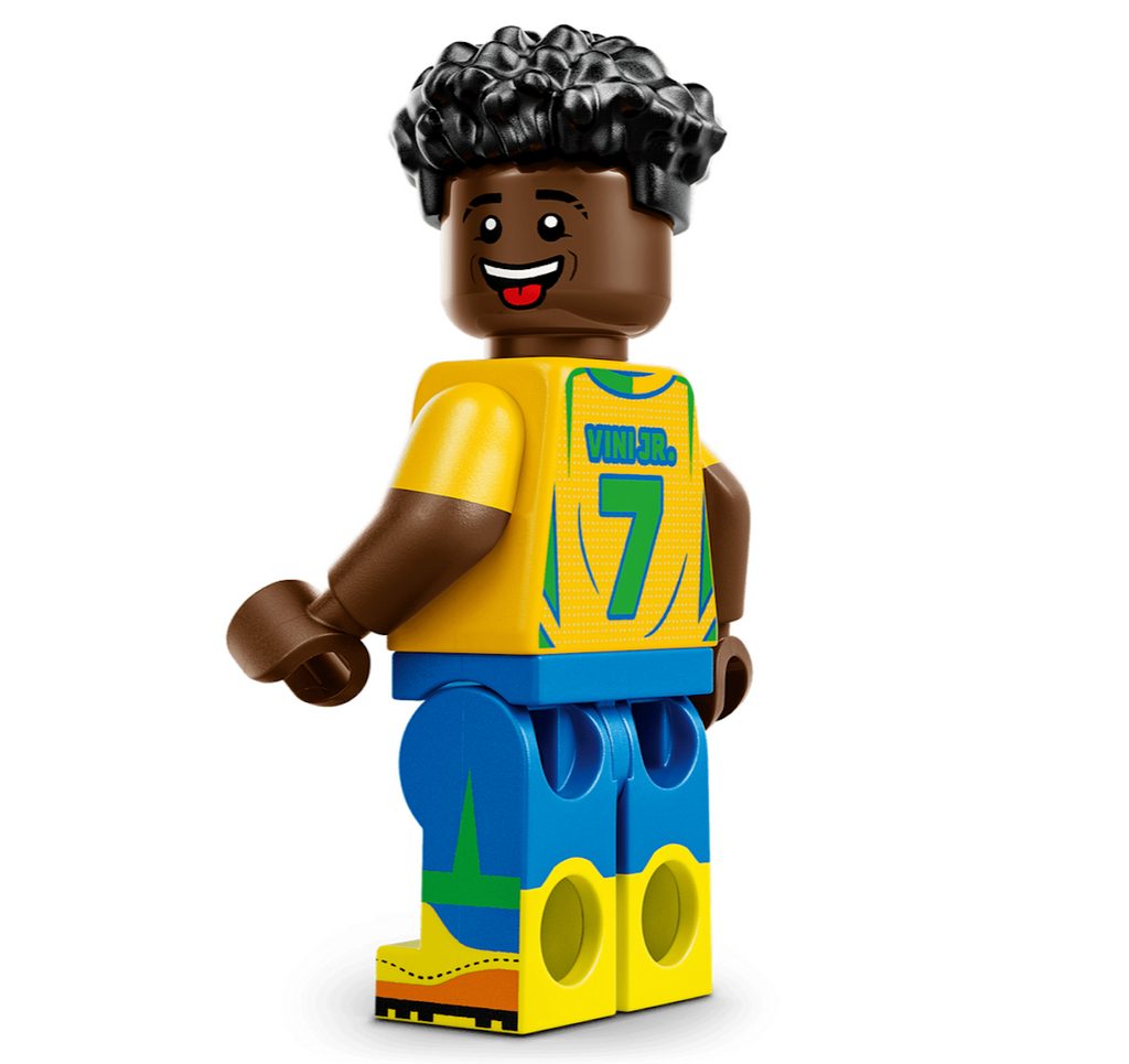 Vini Jr. LEGO minifigure wearing a yellow jersey with green and blue featuring number 7 and his name on the back. 