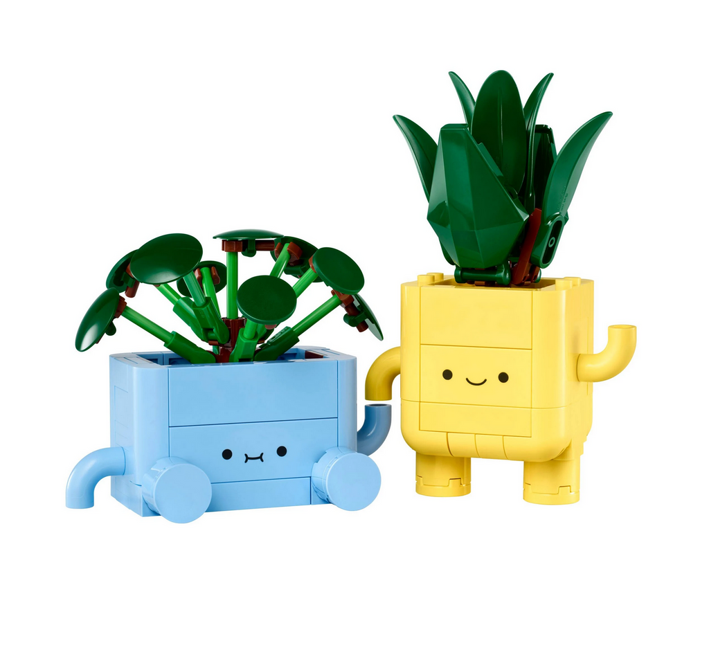 LEGO Botanicals baby dracaena plant that stands up and a baby pilea plant that sits down in yellow and blue planters all built out of LEGO bricks. 