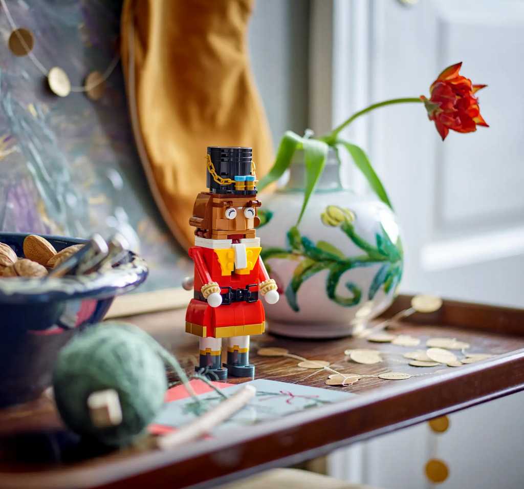 The LEGO Nutcracker built and positioned on a table in the entryway of a home. 