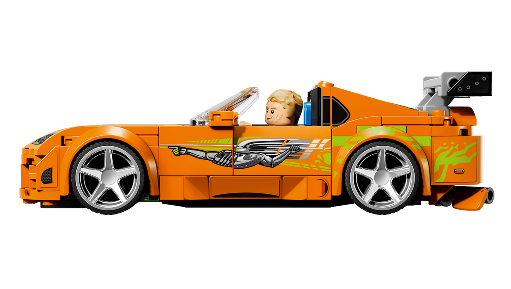  LEGO Speed Champions toy Toyota Supra MK4 from The Fast and The Furious movie  featuring bright orange livery, Troy Lee’s 'Nuclear Gladiator' graphic, a rear wing and 4 novelty rims with a chrome look. The  minifigure of the Brian O’Conner character. 