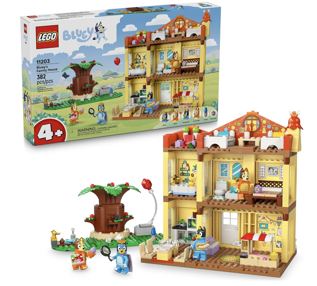 The LEGO Bluey's Family House set, with the completed house with mini figures of the the family members and pets set up in the foreground with the LEGO box that features a picture of the completed house, minifigures and accessories set against an illustrated background. 