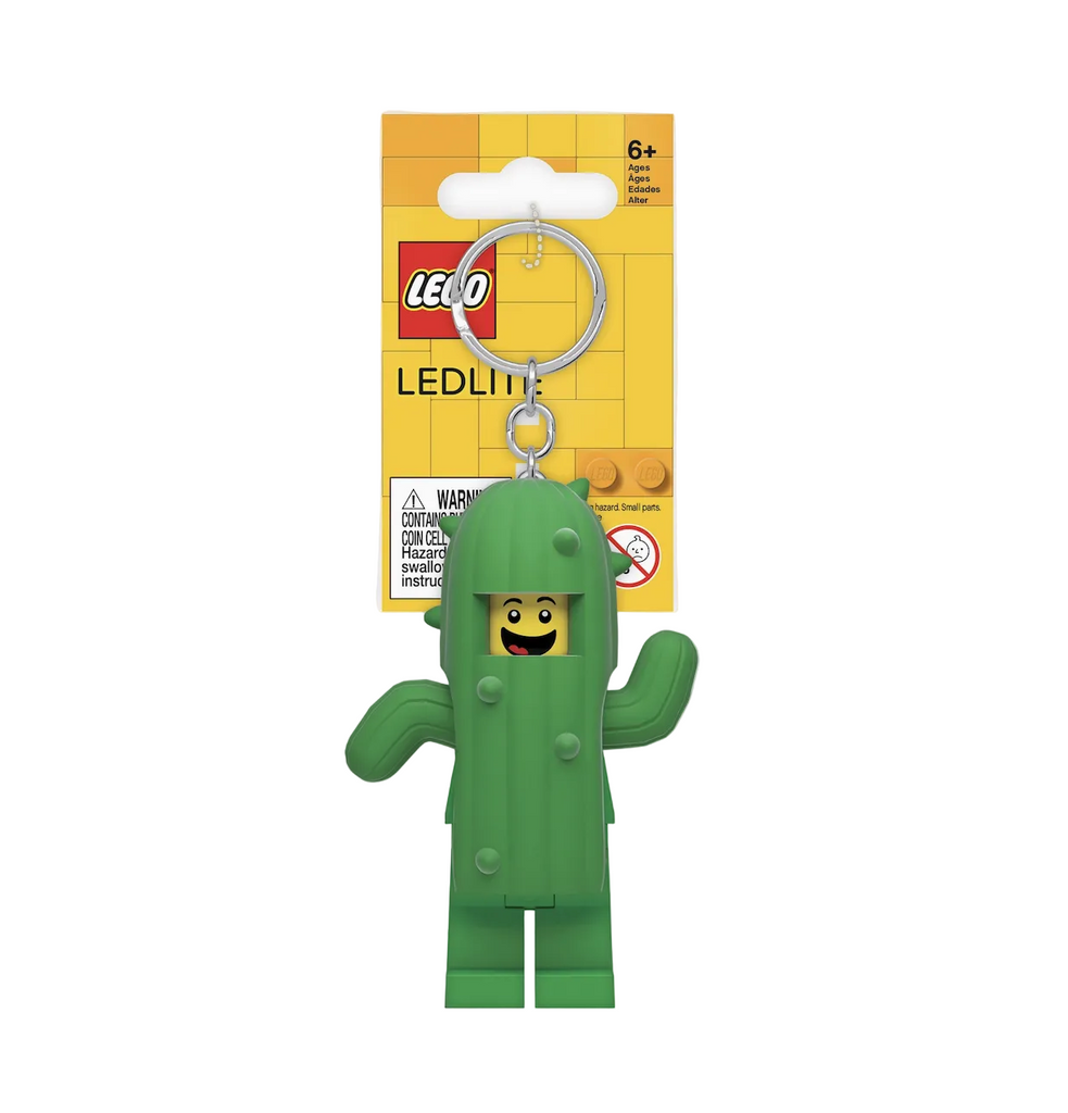 LEGO Minifigure LED keychain, The minifigure is wearing a green cactus costume with a flashlight that shines from both feet. 