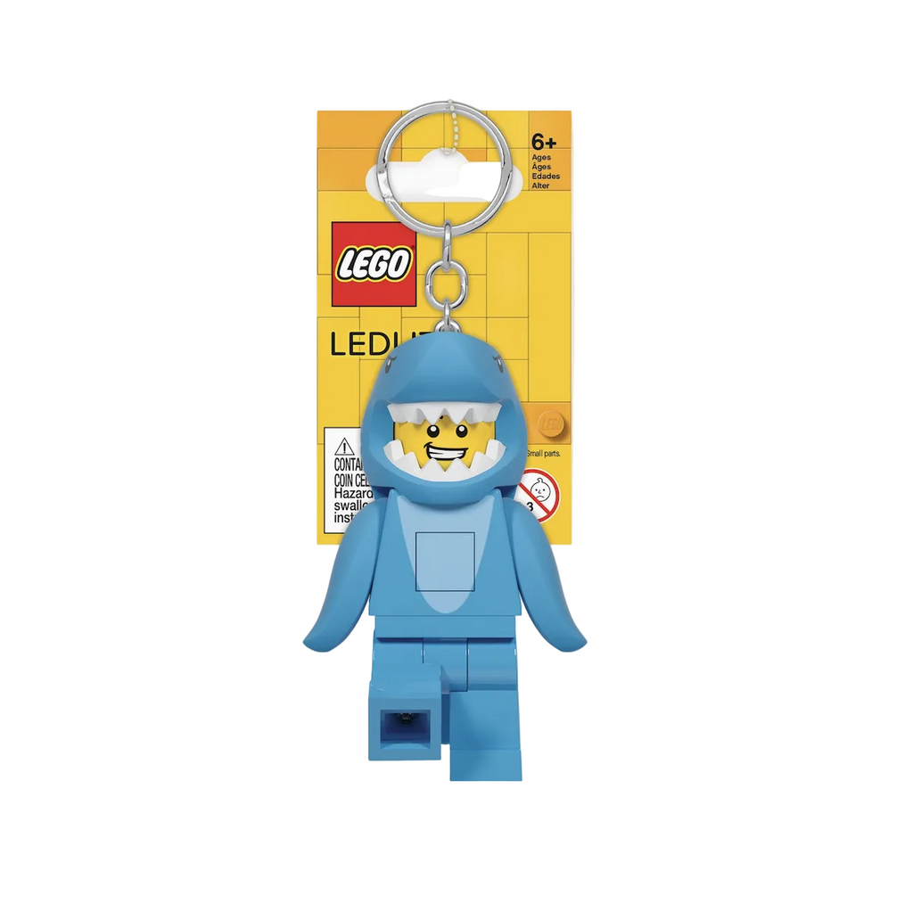 LEGO Minifigure LED keychain, The minifigure is wearing a blue shark suit with a flashlight that shines from both feet. 