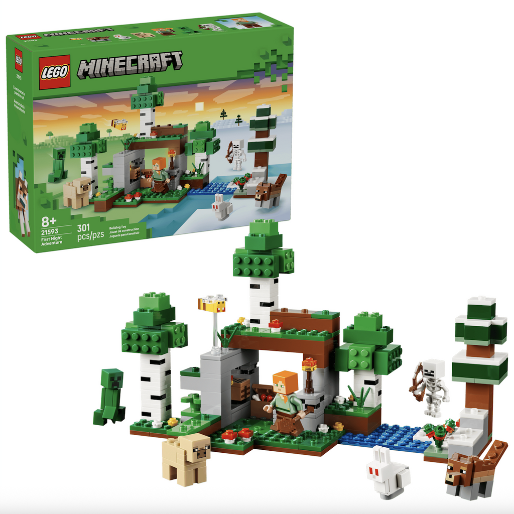 LEGO Minecraft First Night Adventure set that includes trees, a small shelter, a Creeper, a sheep, a skeleton, and other blocky game pieces. he green LEGO box is in the background. 
