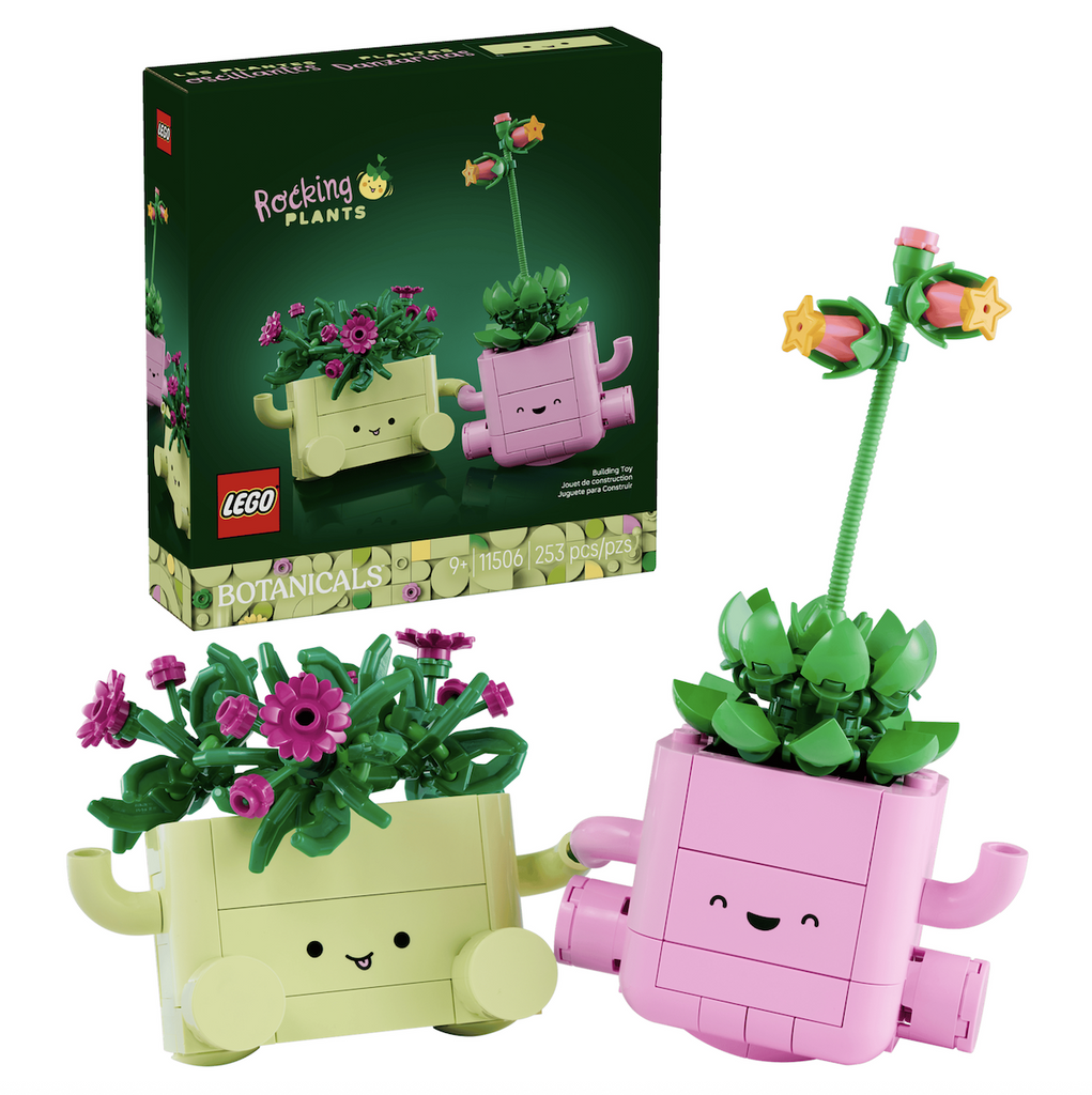 LEGO Botanicals Rocking Plants building set. Two super cute planters with smiling faces and flowering plants sit in the foreground with the green box featuring a picture of the completed build in the background. 