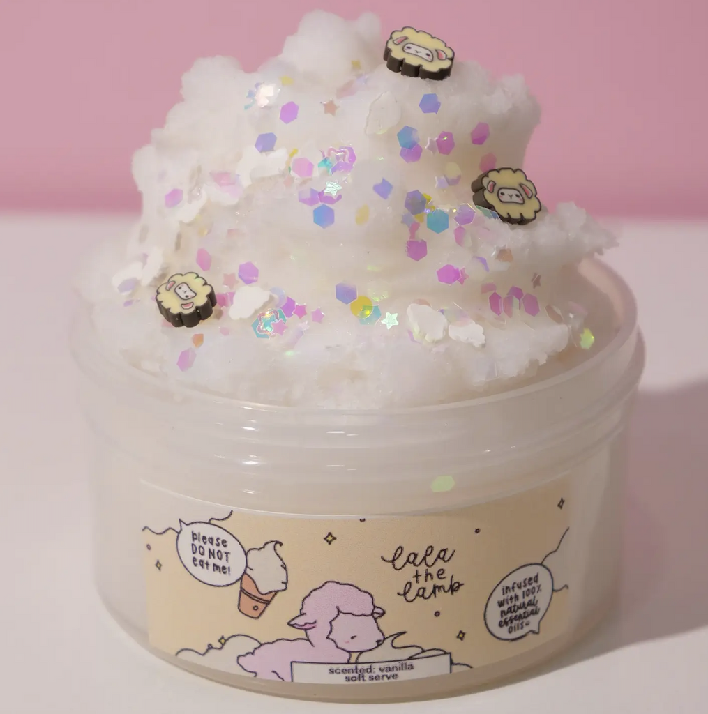 Lala the Lamb white ice cream slime fluffed up in the container with iridescent sprinkles on top. (Not food)