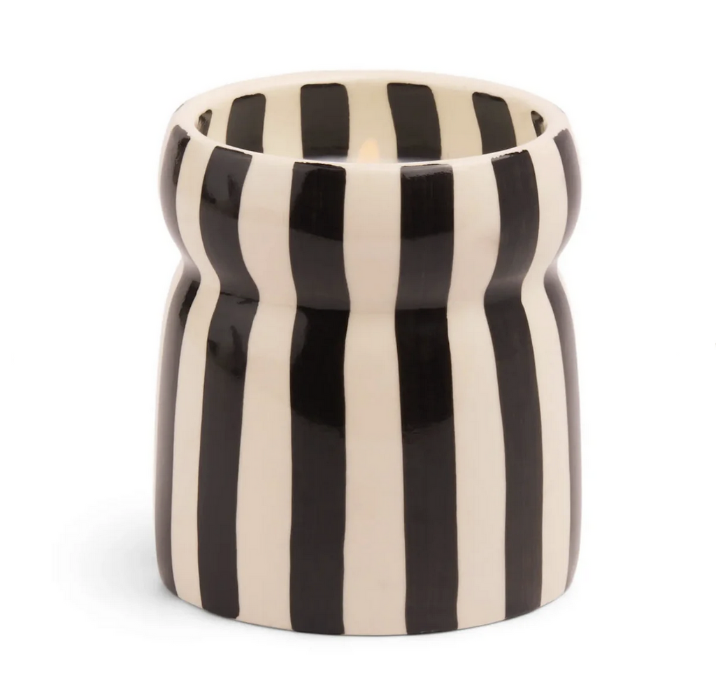 Ceramic candle holder filled with a lava stone scented candle from Paddywax. 