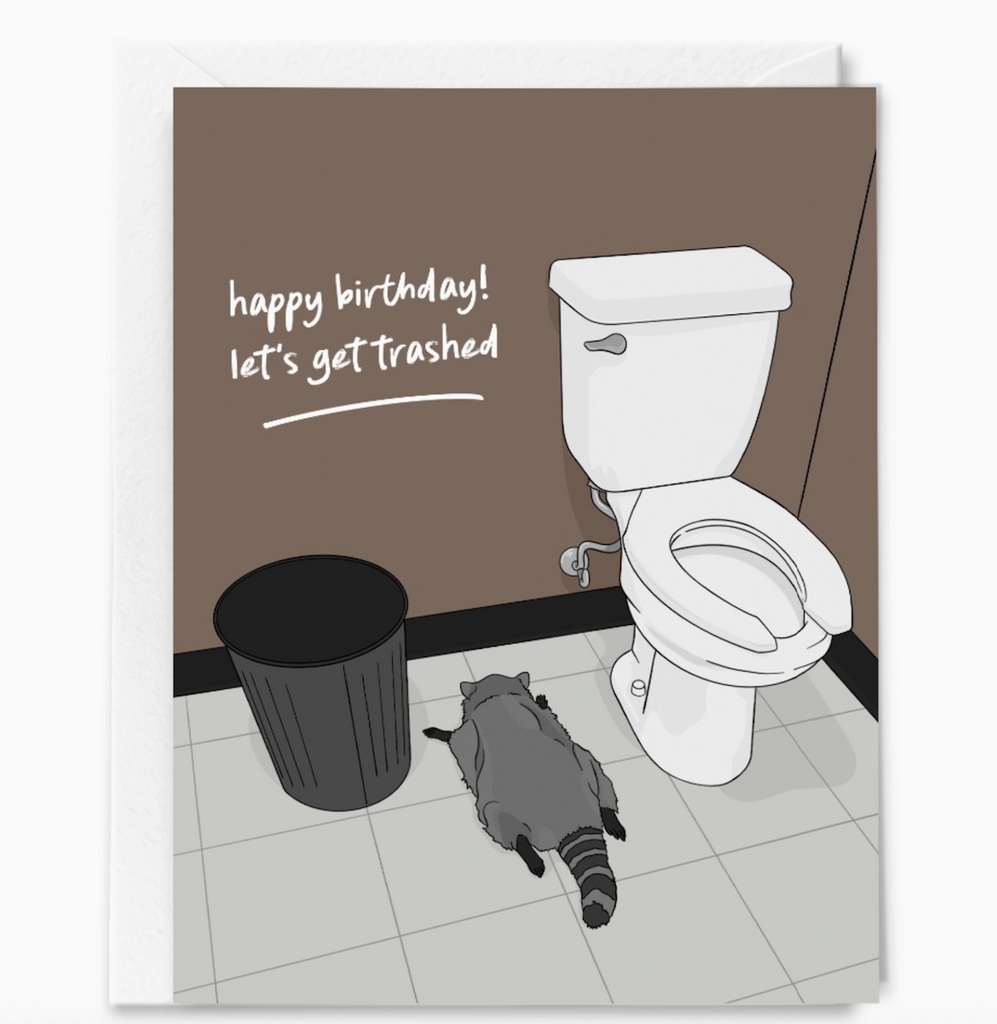 Greeting card with an illustration of a raccoon lying face down beside a toilet that reads "Happy Birthday! Let's get trashed" 