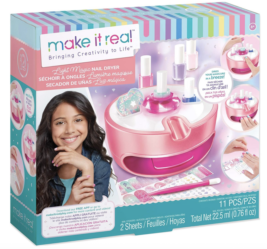Colorful box with a picture of the Light Magic Nail Dryer on the front cover showing the organization capabilities of the nail dryer, the styling tool, nail stickers, and polishes that come with the set. 